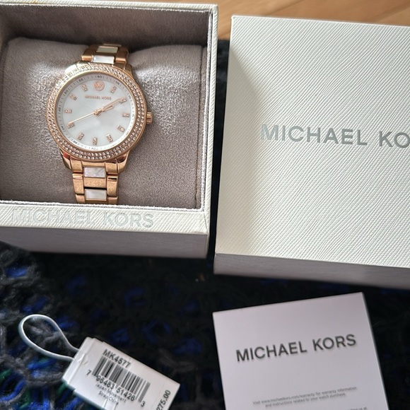 Michael Kors watch. Gold and mother of pearl color. Comes in original box. - Picture 4 of 4